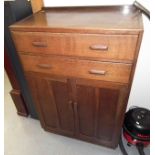 An Oak Utility Cabinet With Two Drawers & Lower Cu