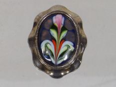 A White Metal Mounted Enamelled Brooch