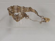 A Yellow Metal Five Bar Gate Bracelet
