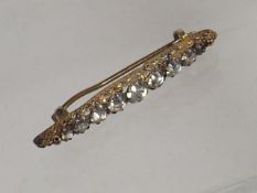 A Yellow Metal & White Stone Brooch