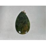 A Jade Pendant With Gold Mount