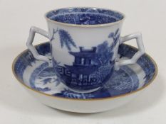 A Nanking Two Handled Tea Cup & Saucer