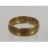 A Discoloured 18ct Gold Wedding Band