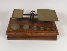 A Large Set Of Oak & Brass Post Office Scales