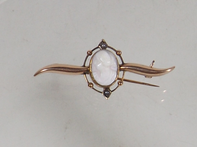 A Gold Brooch With Carved White Coral Cameo & Sout