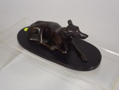 A Bronze Figure Of Recumbent Greyhound