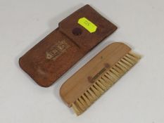 A Rolls Royce Glove Compartment Clothes Brush