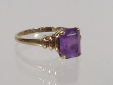 A Ladies 9ct Gold Ring With Purple Stone