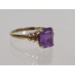 A Ladies 9ct Gold Ring With Purple Stone