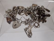 Quality ladies silver charm bracelet of good weigh