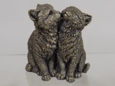 A Pair Of Sterling Silver Cats