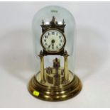 A Vintage Brass Anniversary Clock With Glass Dome