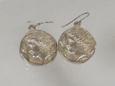 A Pair Of Silver Coin Ear Rings