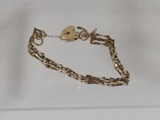 A Ladies 9ct Gold Three Bar Bracelet