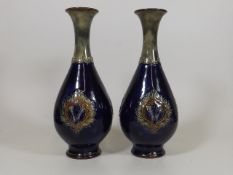 A Pair Of Royal Doulton Stoneware Vases