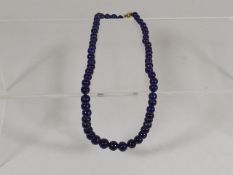 A Lapis Lazuli Necklace With Gold Clasp