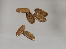 A Pair Of 9ct Gold Cuff Links & One Other