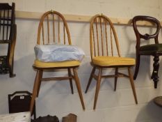 A Pair Of Ercol Light Elm Dining Chairs