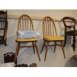A Pair Of Ercol Light Elm Dining Chairs
