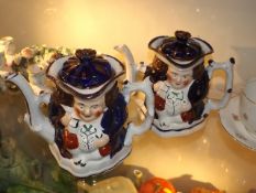 A Pair Of Character Teapots