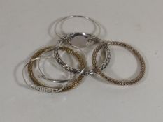 A Collection Of Mostly Silver Bangles
