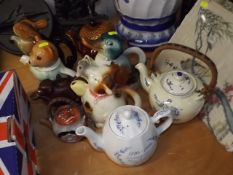 A Quantity Of Novelty Teapots