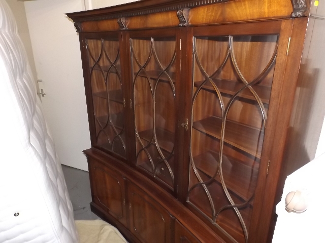 A Glazed Mahogany Bookcase With Cupboards