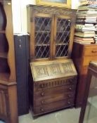 An Oak Glazed Bookcase Bureau With Linen Fold Deco