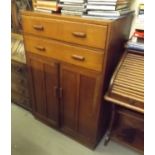 An Oak Utility Cabinet With Cupboard & Two Drawers