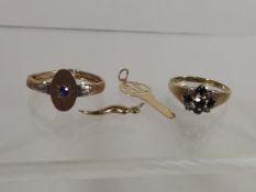 A Diamond & Sapphire Ring Twinned With Other Gold