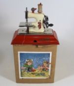 A Vintage Childs Toy Sewing Machine With Original