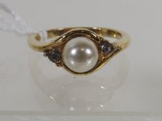 A Pearl & Diamond Ring In Yellow Metal Mount