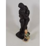 A Resin Figure Of Two Lovers Twinned With A Goebel