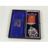 A Silver & Enamel Masonic Badge In Case