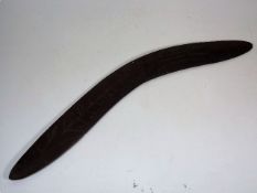 An Antique Boomerang With Carved Decor