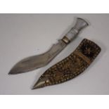 An Asian White Metal Dagger In Decorative Sheaf