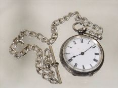 A Silver Pocket Watch With Albert Chain