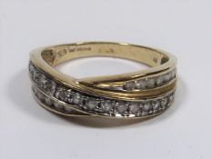 A 9ct Gold Cross Band Ring With White Stones