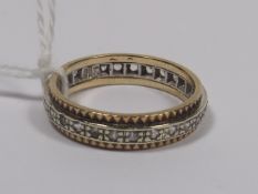 A Yellow & White Metal Eternity Style Ring With Wh