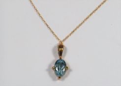 A 9ct Gold Necklace With Blue Stone Pendant