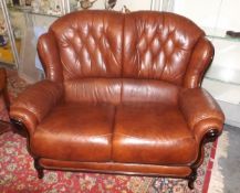 A Small Two Seater Leather Sofa With Burr Walnut D