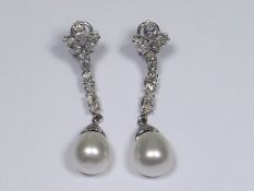 A Pair Of 18ct White Gold Ear Rings With Approx. 4