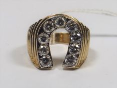 A 9ct Gold Horseshoe Ring With White Stones