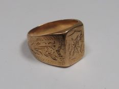 A Yellow Metal Ring With Engraved Decor