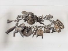 A Vintage Silver Charm Bracelet 59g