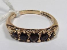 A 9ct Gold Ring With Garnets
