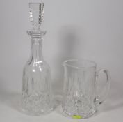 A Cut Glass Waterford Crystal Decanter With Matchi