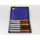 A Boxed Set Of Fruit Knives With Agate Style Handl