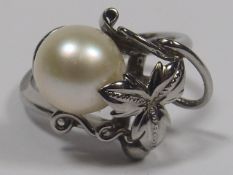 A White Metal Ring With Cultured Pearl