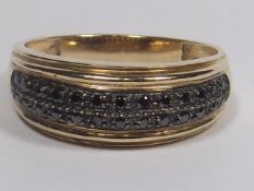 A 9ct Gold Ring With Black Diamonds